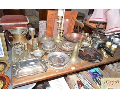 A large quantity of various brass and copper ware to include a carriage lamp; candle sticks; serving dishes; trays etc