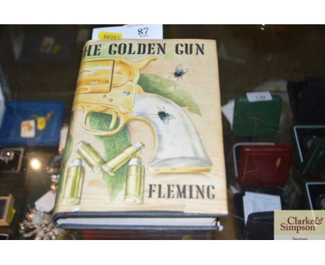 An edition of the "The man with the golden gun" Ian Flemming, first published 1965, printed in Great Britain by Richard Clay 