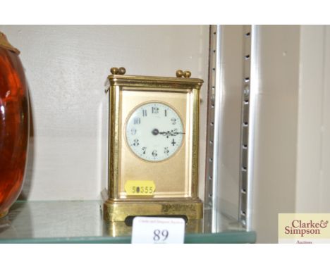 A brass cased carriage clock, lacking key