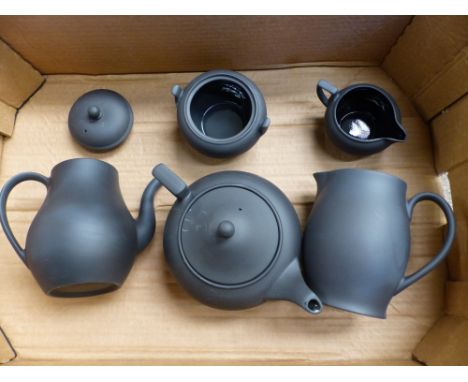 Wedgwood black basalt 5 piece tea service: teapot, coffee pot large and small jugs and a sugar bowl (lid absent)(1 tray).