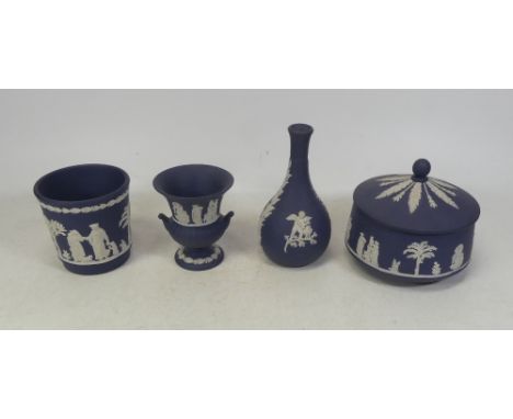 Wedgwood, Four items of Dark Blue Jasperware includes posy vase, two vases and lidded pot (4)