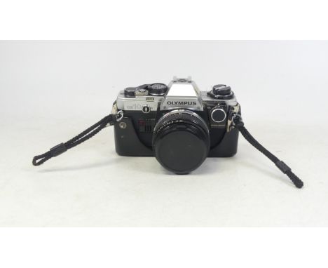 Olympus OM-10 SLR camera with 50mm f1.8 lens and Miranda 650 OM fully dedicated flashgun.