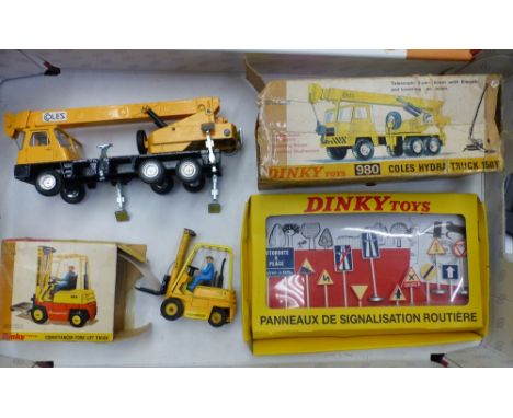 Three boxed Dinky Toys to include a 980 Coles Hydra Truck 150T, Conveyancer Fork Lift Truck and a set of French Road Signs, a