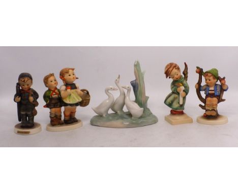 Four Hummel Goebel figures to include Brother &amp; Sister going to market, Chimney Sweep, Heavenly Angel and Apple Tree Boy.