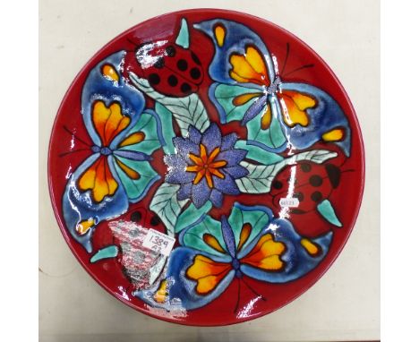 Large Poole charger in circular form, butterflies and ladybirds, diameter 40cm.