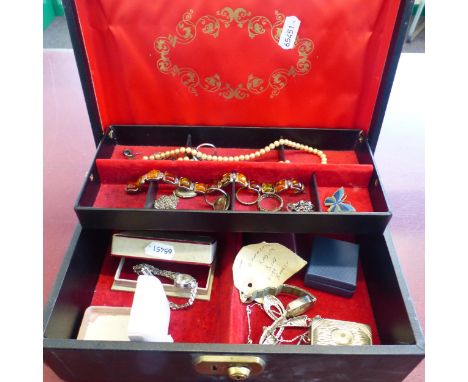 Jewellery box and contents to include Sterling Silver rings, silver and amber bracelet, string of pearls, white metal vesta c