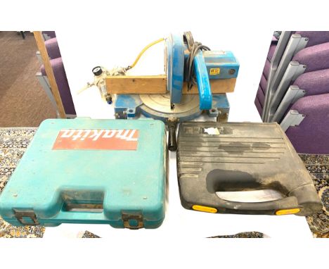 Selection of assorted tools includes chop saw makita drill and stapler 