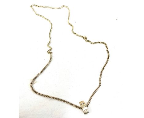 Long silver chain and pendant set with three white stones 