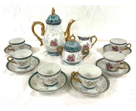 6 Place setting tea service, marked "Japan" to base, with musical tea pot 