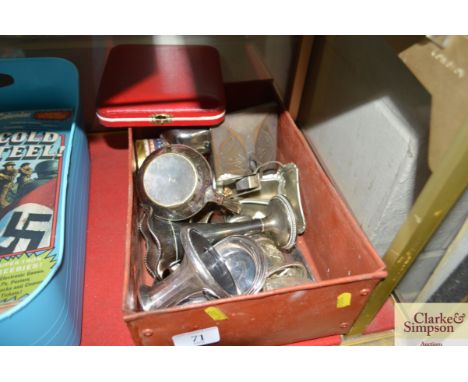 A box of assorted metal ware to include spill vase, napkin rings, candlestick etc.