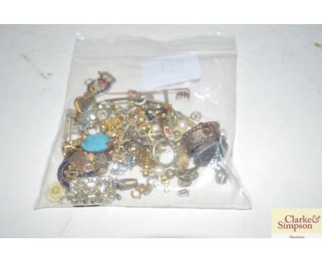 A bag containing various ear-rings; yellow metal chains; stick pin etc.