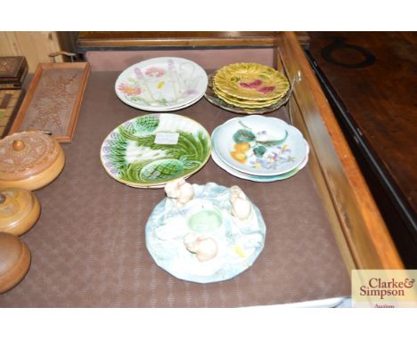 A Sylvac planter decorated with three rabbit; a collection of Sarreguemines pottery plates and various Majolica style plates 