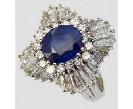 White gold sapphire and diamond large fancy ring, the central oval sapphire approximately 4ct, surrounded by brilliant and ba