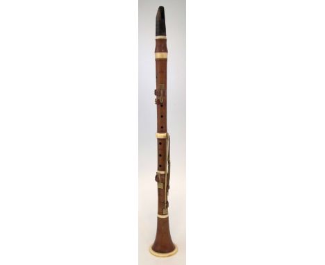 Boxwood Clarinet by J.S. Wood, London,   with ivory fittings, stamped with New Compton Street Soho address, 67cm long