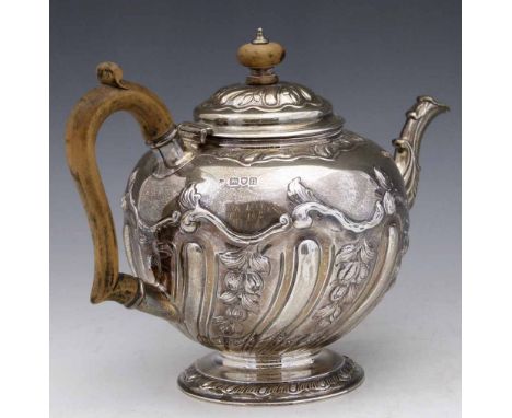 Embossed silver globular teapot London 1908, with wooden handle and knop, 24oz 19dwt gross.    Condition report: hallmarks wo