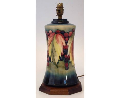 Moorcroft lamp base, decorated with leaves and berries pattern, mounted on modern Moorcroft wood base, 28cm high, 37cm overal
