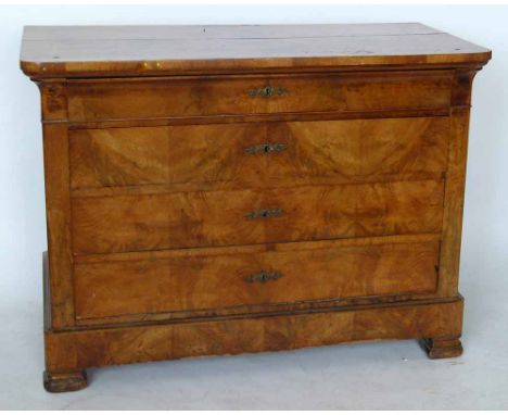 Continental walnut commode, 19th century, of four long drawers, width 130cm.