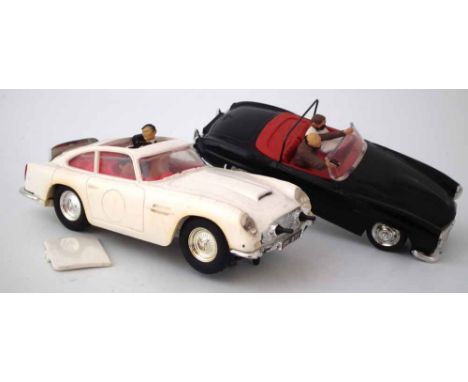 Scalextric James Bond pair of Cars, white Aston Martin DB4 with bullet proof shield, sunroof and bandit, the black Mercedes 1