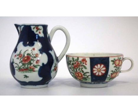 Worcester cream jug and a teacup circa 1770   painted with flora within blue scale grounds, (2)     Condition report: No gild