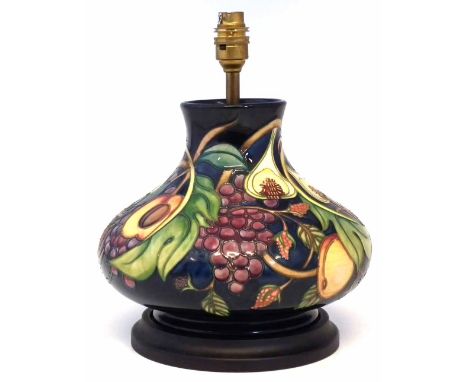 Moorcroft lamp base, decorated with Queen's Choice pattern, fitted with wood base, 20cm high, 30 cm overall height including 