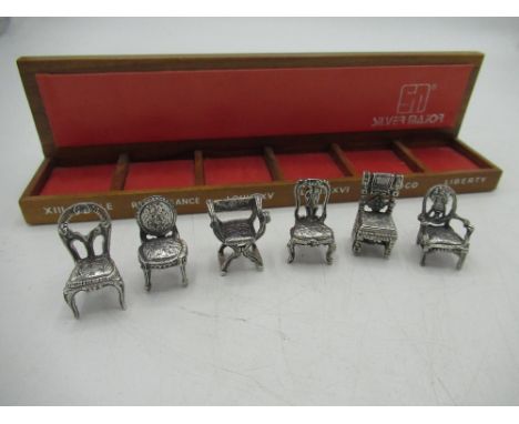 Set of six continental sterling silver miniature period chairs with a small display shelf 1.83ozt 