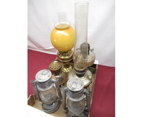 Edwardian oil lamp base, with faceted glass reservoir on cast metal and pierced tapering base, two galvanised Tilley lamps, b
