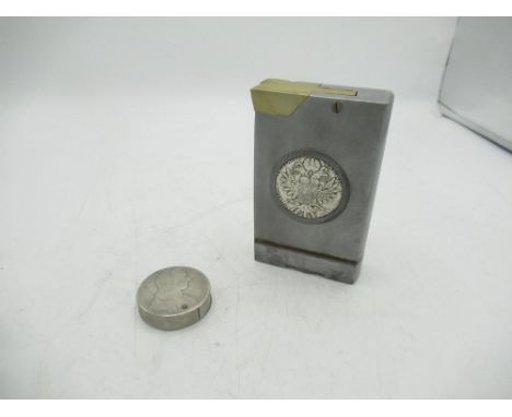 Large metal lighter with Maria Theresa coin encased and a circular Maria Theresa coin lighter (2) 