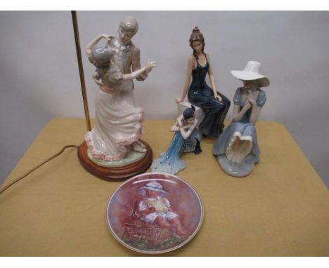 Nao figure of a seated lady in a hat, manufactures mark to the base and impressed no.A-21 M, H28cm, Lladro style table lamp i