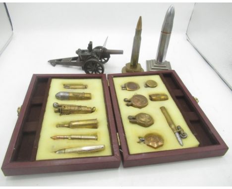 Cased set of 13 Trench Art lighters, American table lighter designed as an Artillery piece and 2 Bullet desk lighters (16) 