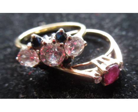 18ct yellow gold sapphire and white stone ring, size O, 3.8g and a 14ct yellow gold ruby ring, size M, 2.1g (2) 