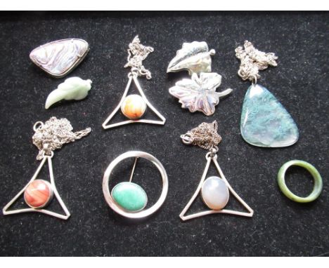 Three abalone shell and sterling silver mounted brooches, a jade leaf form brooch, three openwork triangular pendants with ca