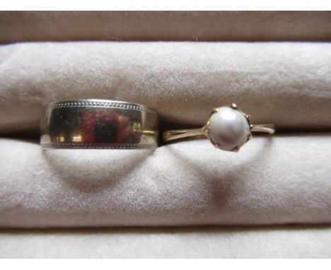 Hallmarked 9ct white gold wedding band size M, and a 9ct yellow gold ring set with a simulated pearl, size N, 4.2g 