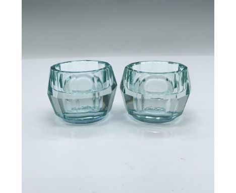 Beautiful candle holders designed by Karim Rashid. They come in their original box which measures 6"L x 3.75"W x 2.75"H. Arti