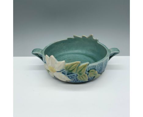 Pottery featuring broad blossoms and trailing ivy on a textured background. Roseville backstamp. Issued: 1940sDimensions: 8.5