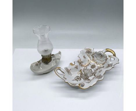Beautiful vintage pieces of ivory porcelain with gold detailing. The leaf-shaped dish measures 9"L x 5.5"W x 2"H. It has a Ro