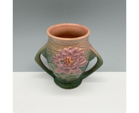 Adorable double handled pottery with a large floral design around its body. Roseville backstamp. Issued: 1940sDimensions: 5"L