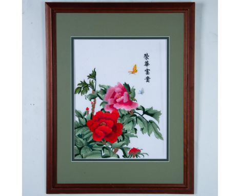 Original embroidered Chinese design with vibrant silk threads on a white cloth background featuring red and pink peonies with