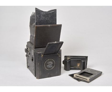 A Houghton Butcher Popular Pressman Reflex Camera, an American import example, with Aldis Anastigmat 6'' f/4.5 lens, roll fil