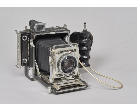 A Graflex Crown Graphic 4 x 5 Camera, with Rodenstock Heligon 80mm f/2.8 lens, shutter working but sometimes aperture blades 