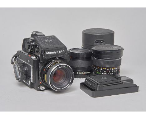 A Mamiya M645 Outfit, serial no J98656, with metered prism viewfinder, shutter working, body G, slight wear to back, with Mam