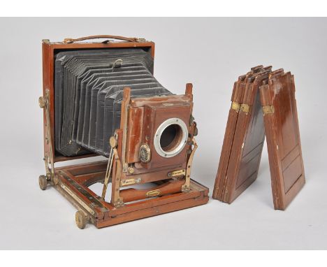 A Houghton Triple Victo mahogany and brass Half-Plate Field Camera,  with Thornton-Pickard roller-blind shutter and three dds