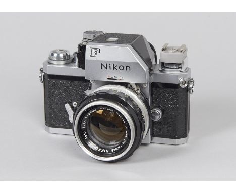 A Nikon F Photomic FTn SLR Camera,  serial no. 7082732, chrome, shutter working, body G, light scratching to base and rubbing