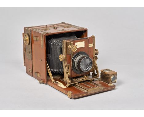 A rare Houghton Sanderson Tropical teak and brass 3¼in x 4¼in Focal Plane Shutter Hand and Stand Camera,  with Zeiss Tessar f