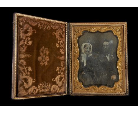 A Half-Plate Portrait Daguerreotype of an Elderly Couple,  cased, F, some surface scratching and edge oxidisation, and sixth-