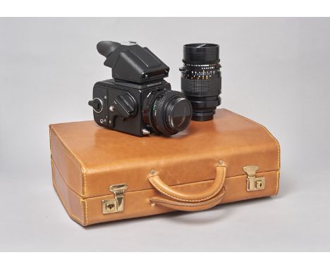 A Hasselblad Black 2000FC Camera Outfit, serial no RV154745, Prism viewfinder, waist level viewfinder, film magazines (2) ser