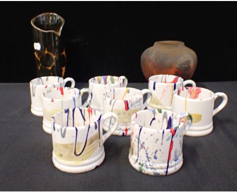 EIGHT PAINT SPATTERED SMALL MUGS with a Poole Pottery modernist vase and another studio pottery vase