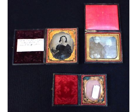 A CASED DAGUERROTYPE PORTRAIT OF AN ELDERLY COUPLE with a cased ambrotype, and an empty case (3)