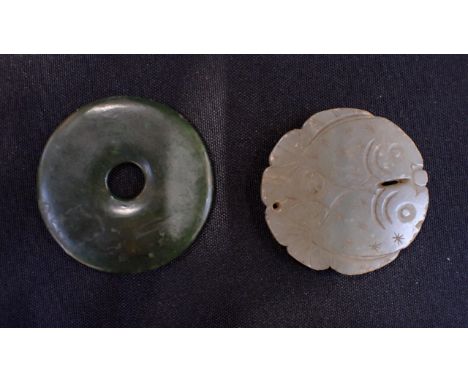 A JADE BI DISC CARVED WITH TWO FISH with another dark green plain bi disc
