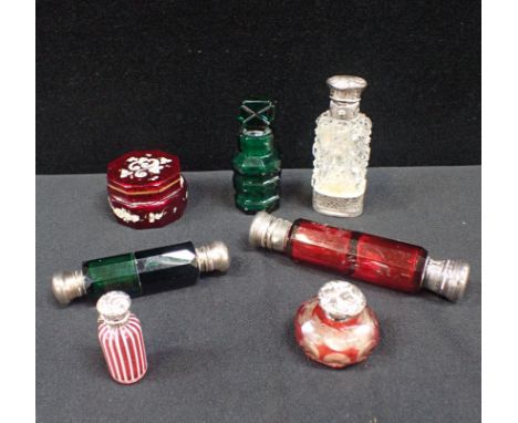 A GROUP OF 19TH CENTURY SCENT BOTTLES one Nailsea type, two double-ended, some silver topped, and a Bohemian glass pot (7)