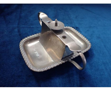 A SILVER TABLE CIGAR LIGHTER BY JOSEPH BRAHAM London 1904, double-handled with central burner flanked by holes for cutters (n